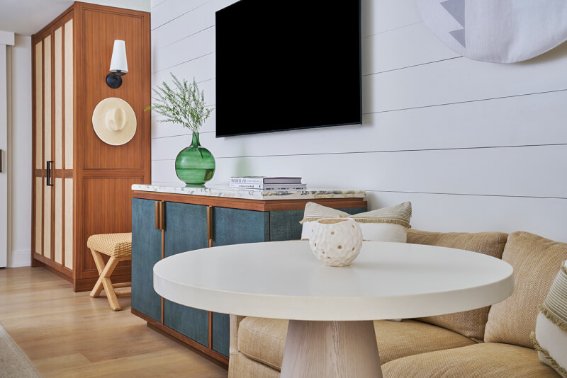 this image depicts a hotel room with a table and chairs